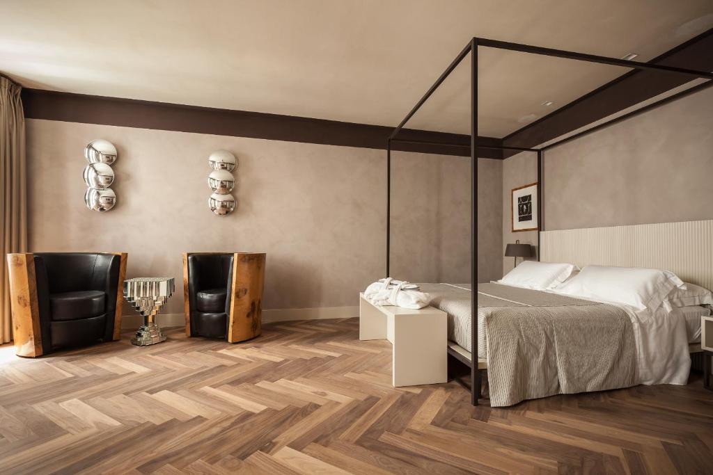 Postel nebo postele na pokoji v ubytování Liassidi Wellness Suites