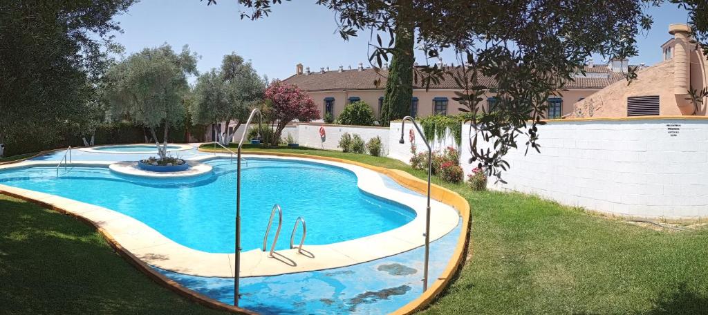 a swimming pool in the yard of a house at SEVILLA BRISAS VIP ONE Valencina de la concepción in Seville