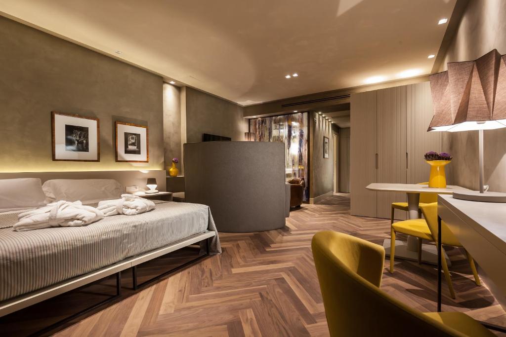 Postel nebo postele na pokoji v ubytování Liassidi Wellness Suites
