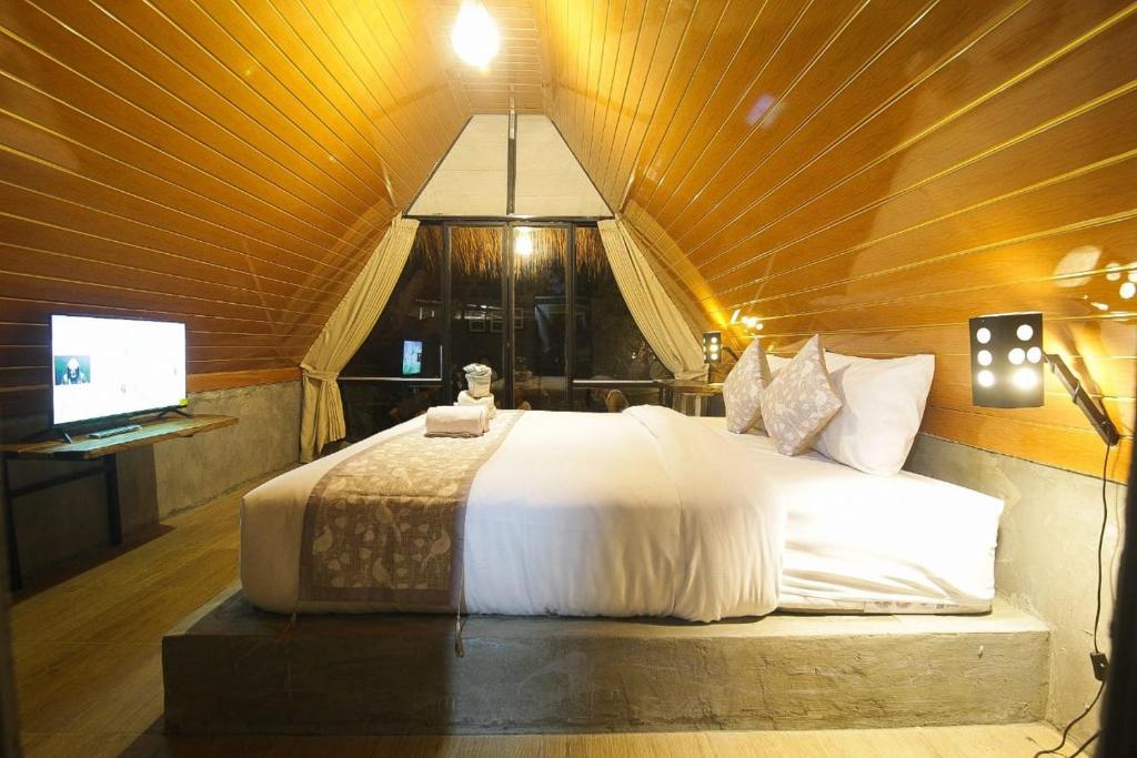 Postel nebo postele na pokoji v ubytování Mangoforest Bali