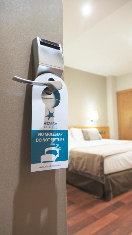 Postel nebo postele na pokoji v ubytování Hotel Real