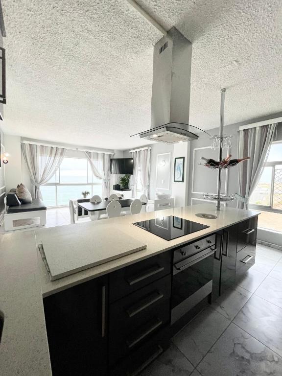 a kitchen with a large island in the middle at 201 on Seagull in Margate
