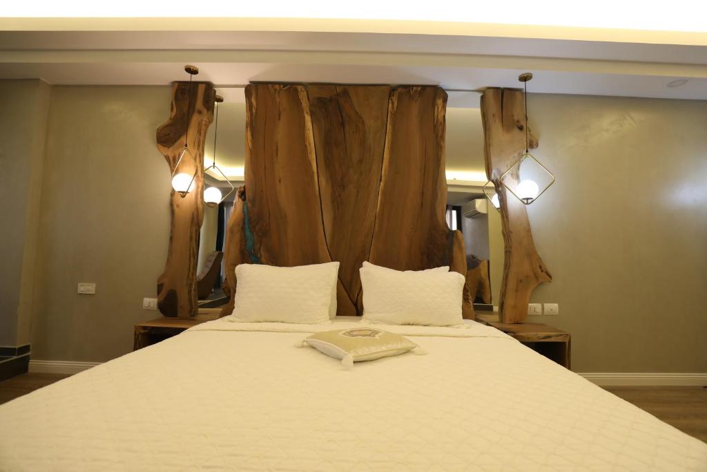 Postel nebo postele na pokoji v ubytování Hotel 1 Maji