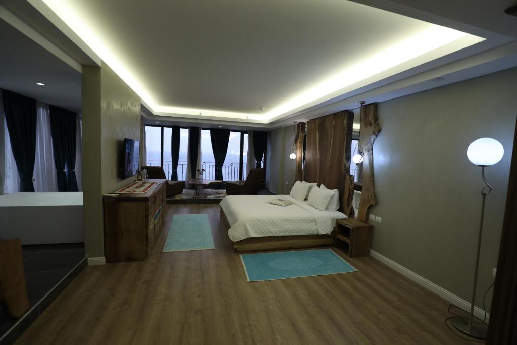 Postel nebo postele na pokoji v ubytování Hotel 1 Maji