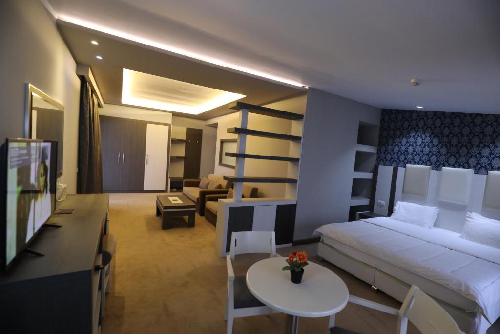 Postel nebo postele na pokoji v ubytování Hotel 1 Maji