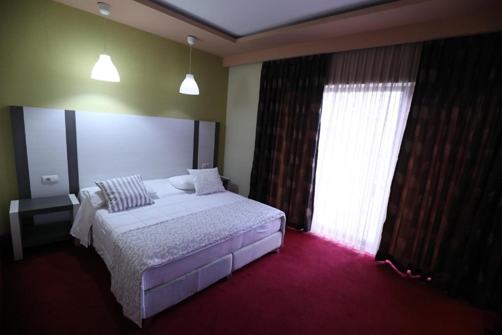 Postel nebo postele na pokoji v ubytování Hotel 1 Maji