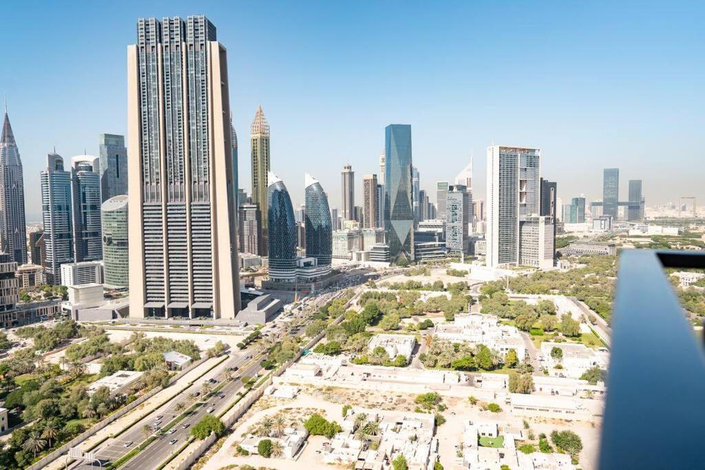 an aerial view of a city with tall buildings at Downtown Views 2BR Luxury Apartment Pool and City Skyline in Dubai