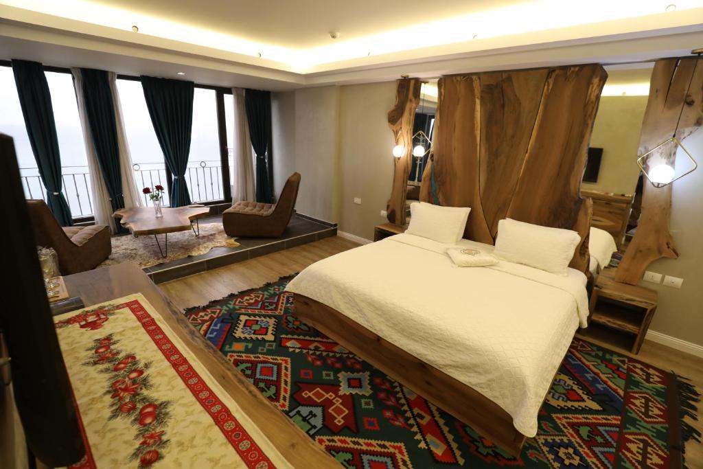 Postel nebo postele na pokoji v ubytování Hotel 1 Maji
