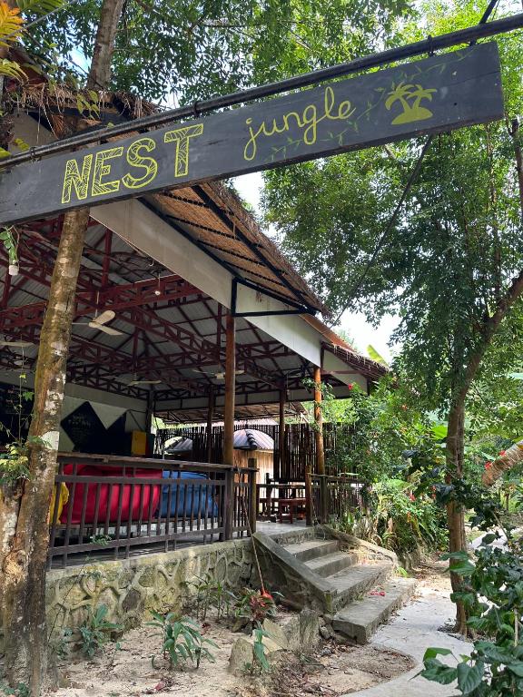 a restaurant with a sign that readsnext jungle at Nest Jungle in Kaôh Rŭng (3)