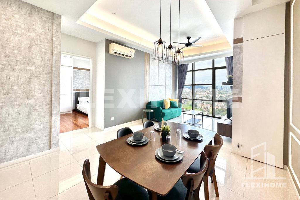 a dining room and living room with a table and chairs at 1-5 Guests, 2BR Family Home, Azure Residences PJ-Beside Paradigm Mall - Flexihome MY in Petaling Jaya