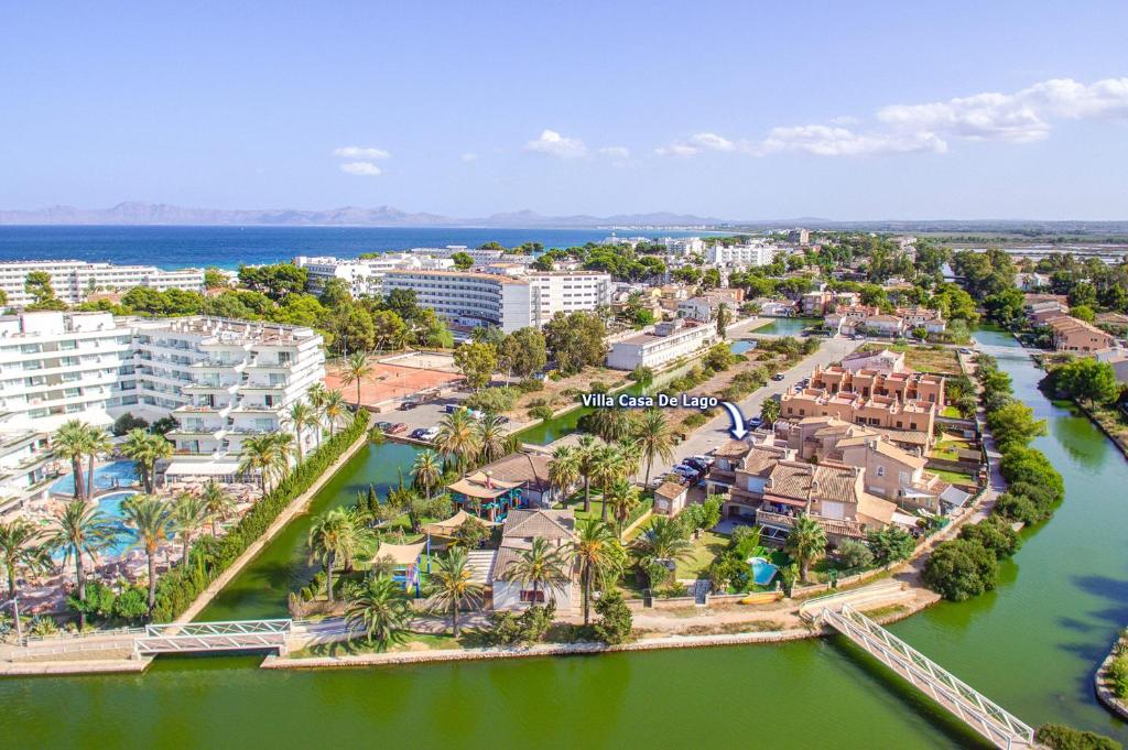an aerial view of the resort and the river at Villa Casa de Lago by Villa Plus in Playa de Muro