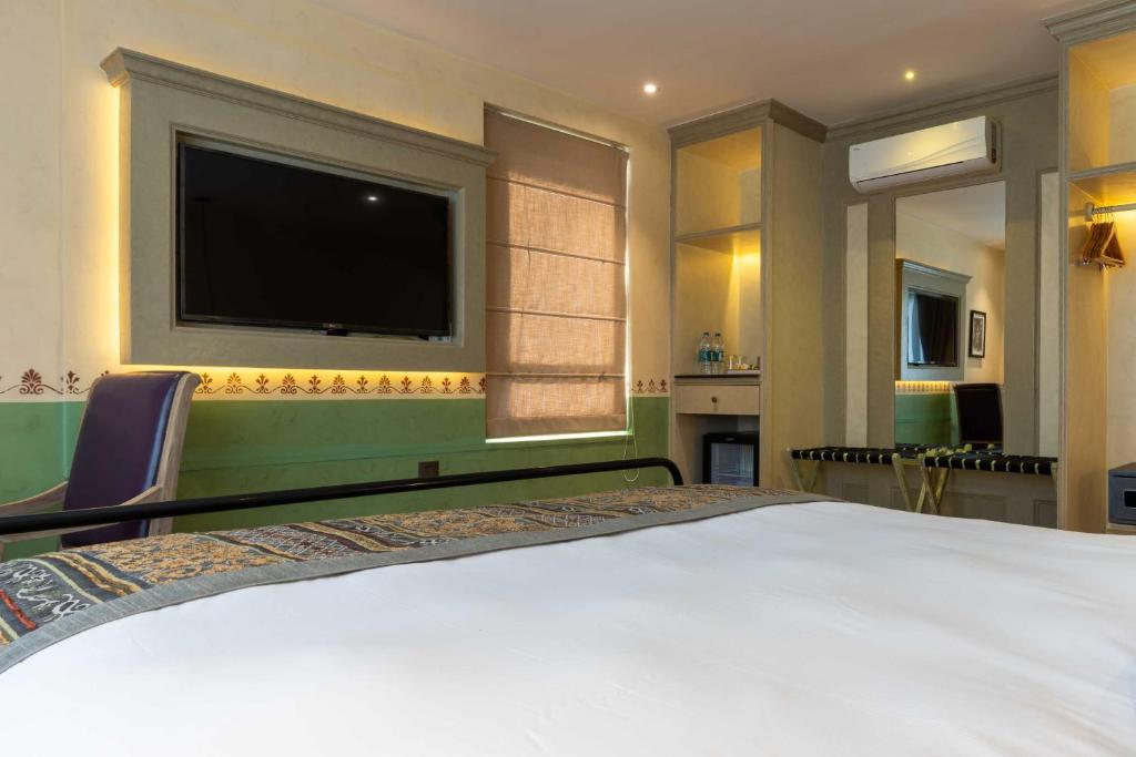 Postel nebo postele na pokoji v ubytování Seto Ghar Hotel