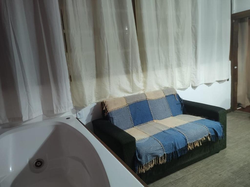 Un ou plusieurs lits dans un hébergement de l'établissement Casa Toque toque pequeno