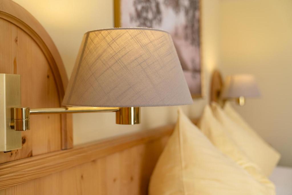 Postel nebo postele na pokoji v ubytování Hotel Restaurant Lebzelter