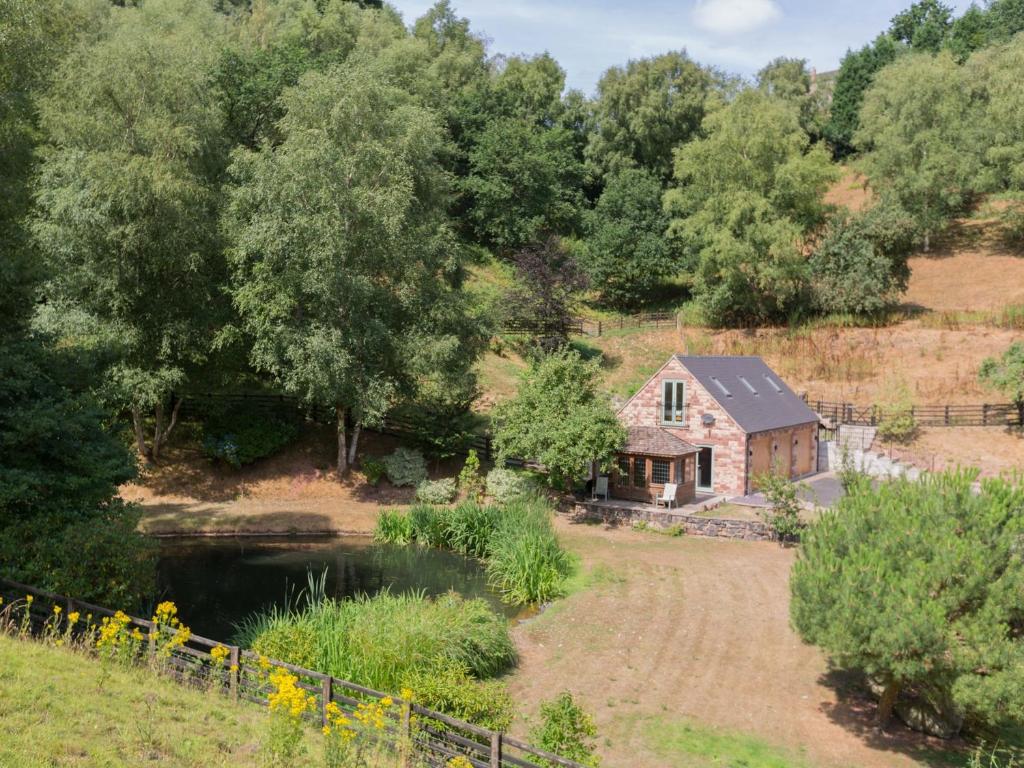 an old stone house on a hill next to a river at 1 bed property in Alton 62237 in Alton