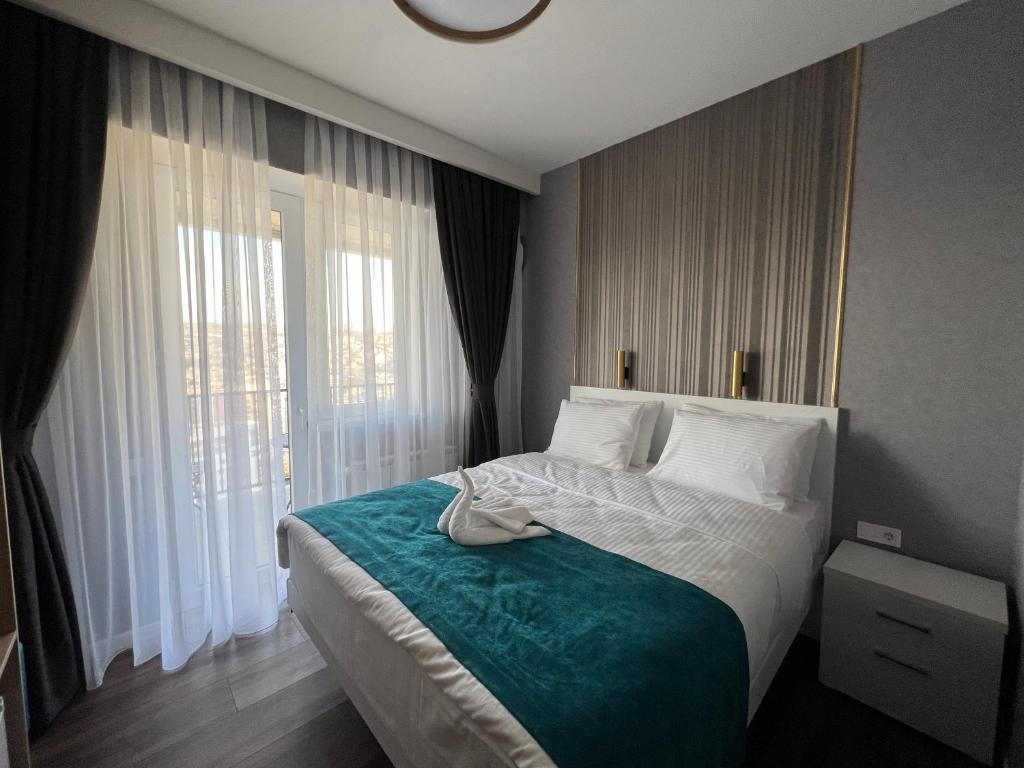 Postel nebo postele na pokoji v ubytování Hotel Babi