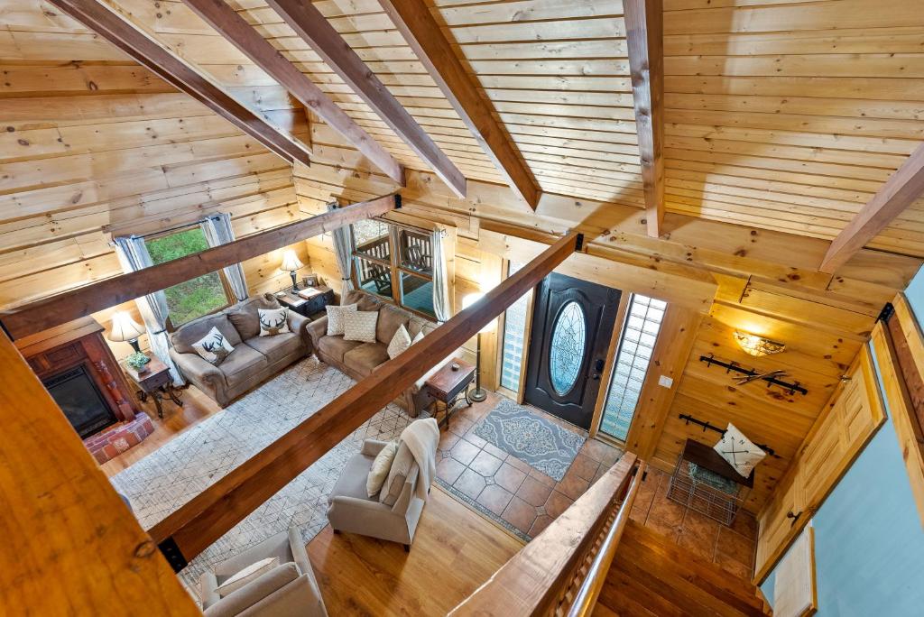 an overhead view of a living room in a log cabin at Antlers Crossing in McGaheysville