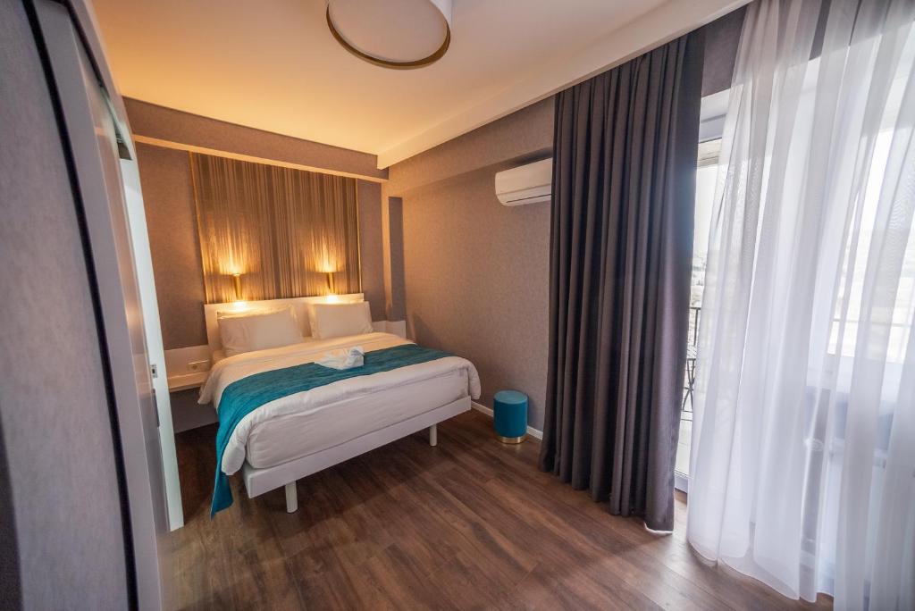 Postel nebo postele na pokoji v ubytování Hotel Babi