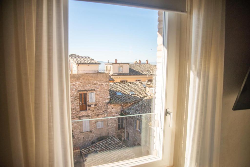 Nespecifikovaný výhled na destinaci Assisi nebo výhled na město při pohledu z prázdninového domu