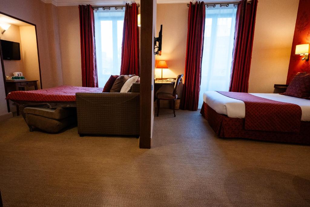 Postel nebo postele na pokoji v ubytování Cit'Hotel Sphinx - Hotel