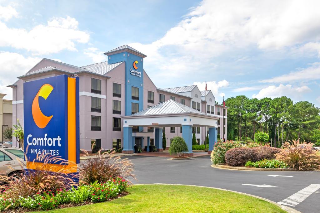 a hotel with a c content sign in front of it at Comfort Inn & Suites Carrollton in Carrollton