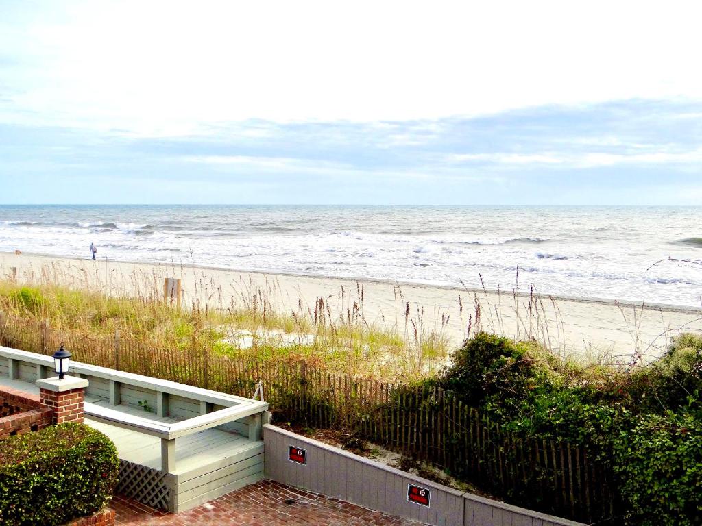 a view of the beach from a house at Beachfront Bliss-Admirals Quarters II Oceanfront in Myrtle Beach