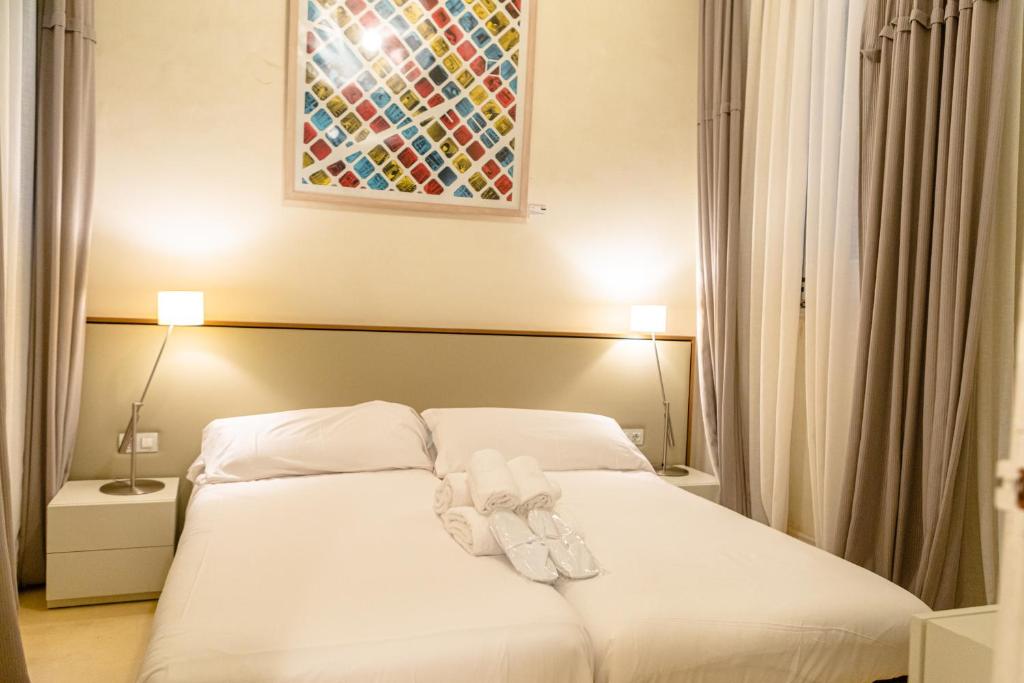 Posteľ alebo postele v izbe v ubytovaní B&B Boutique Ca La Maria