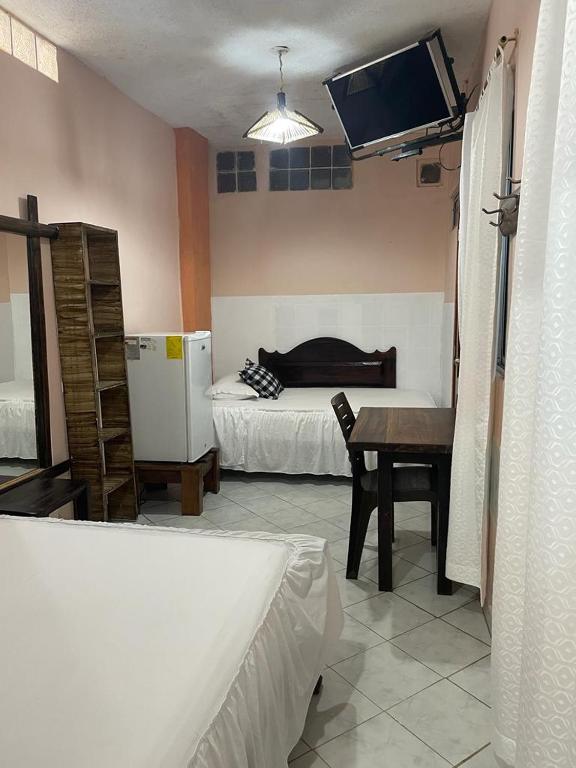 Postel nebo postele na pokoji v ubytování Hotel La Barca