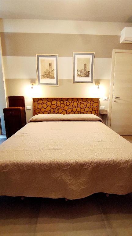 Postel nebo postele na pokoji v ubytování Gli Ulivi Rooms