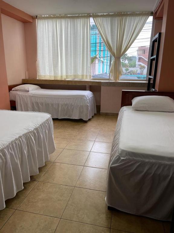 Postel nebo postele na pokoji v ubytování Hotel La Barca
