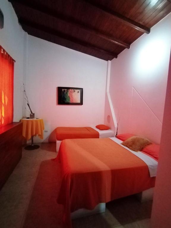 Postel nebo postele na pokoji v ubytování Hotel Cocos