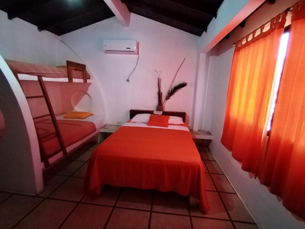 Postel nebo postele na pokoji v ubytování Hotel Cocos