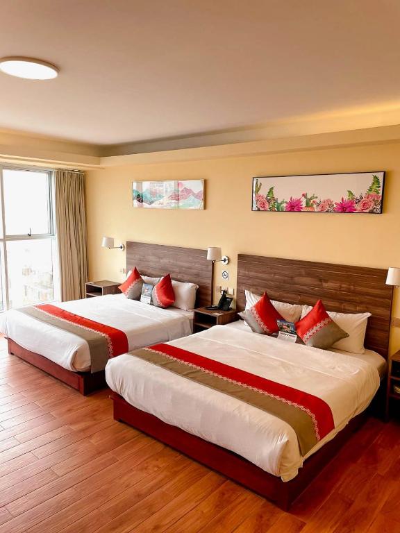 Postel nebo postele na pokoji v ubytování SM HOTEL Plus