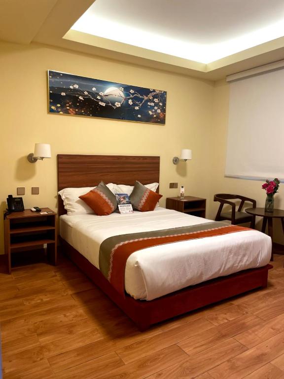 Postel nebo postele na pokoji v ubytování SM HOTEL Plus