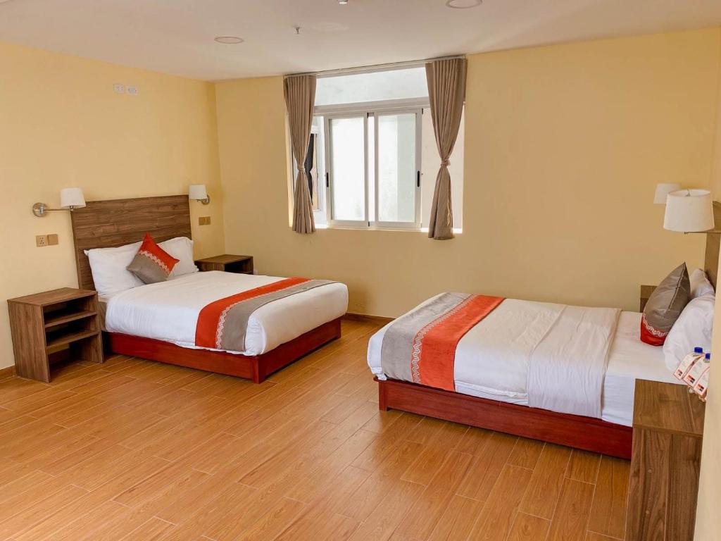 Postel nebo postele na pokoji v ubytování SM HOTEL Plus