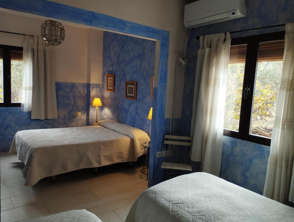 Łóżko lub łóżka w pokoju w obiekcie Hotel Finca Aldabra