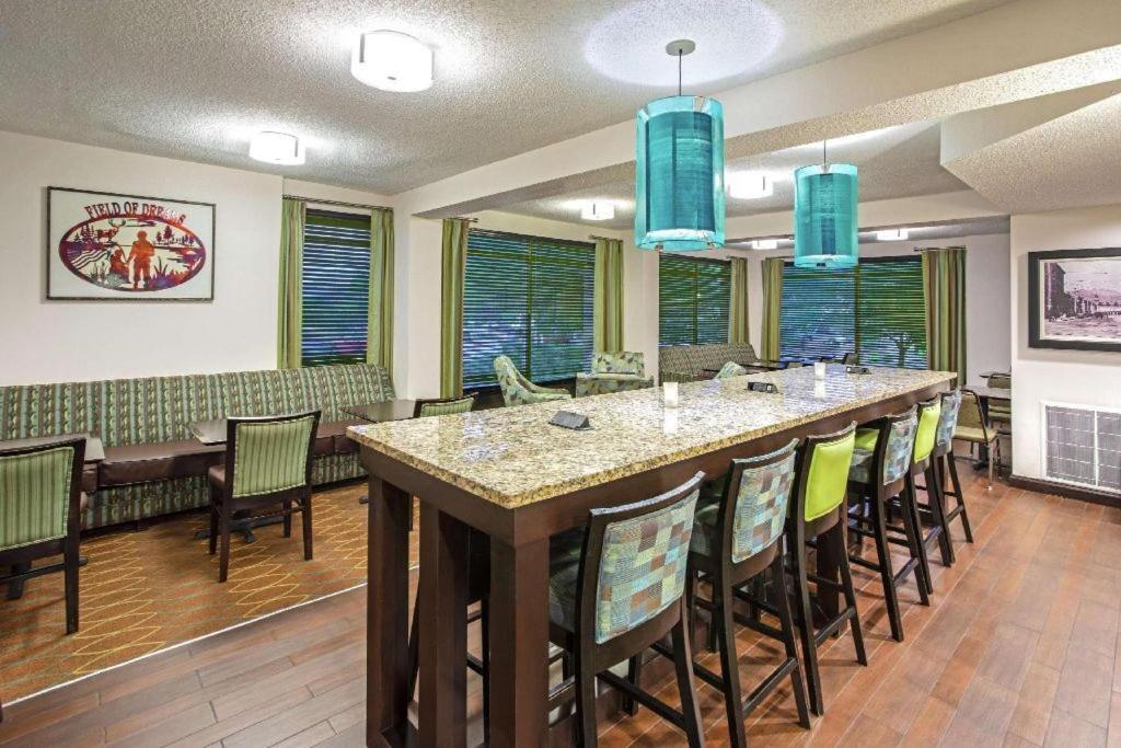 a large dining room with a large table and chairs at Woodmen Inn in Colorado Springs