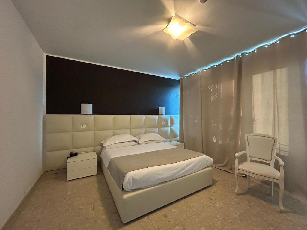 Postel nebo postele na pokoji v ubytování Hotel Noventa