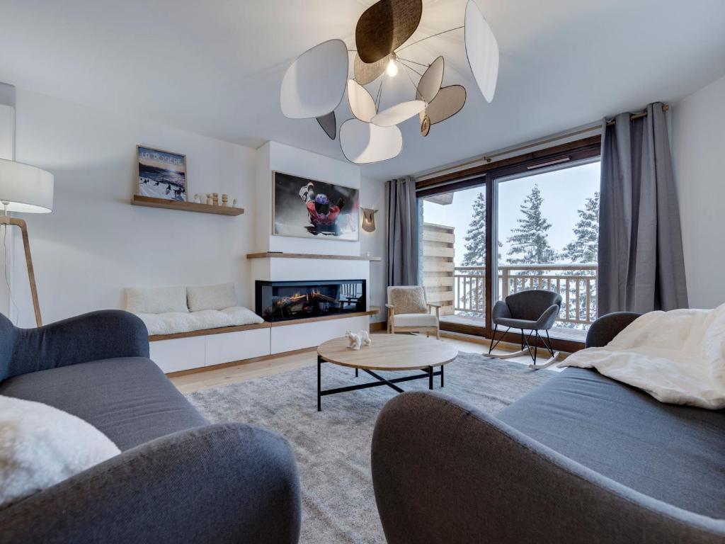 a living room with two couches and a fireplace at Appartement Montvalezan-La Rosière, 5 pièces, 10 personnes - FR-1-690-19 in Montvalezan