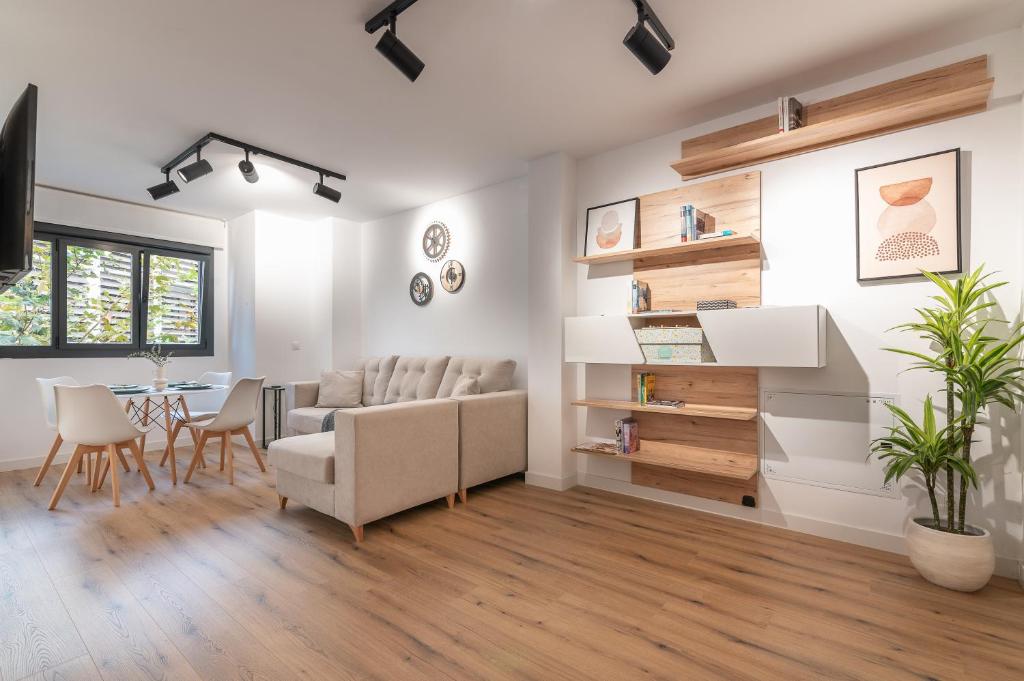 a living room with a couch and a table at Apartamento Casiopea in Santander