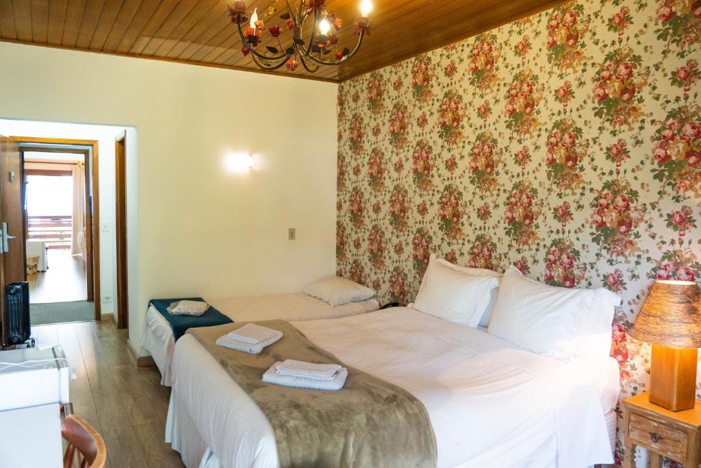 Postel nebo postele na pokoji v ubytování Hotel Ascona