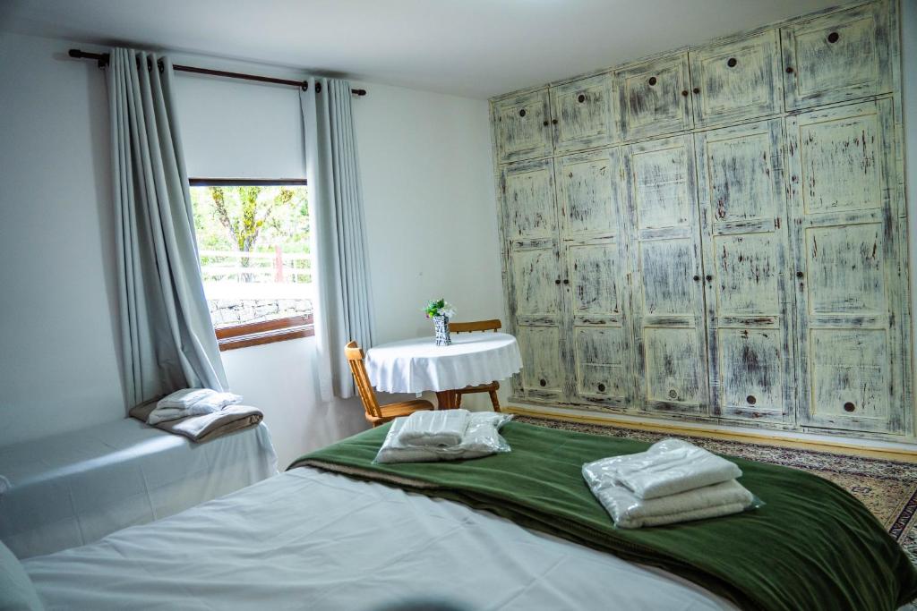 Postel nebo postele na pokoji v ubytování Hotel Ascona