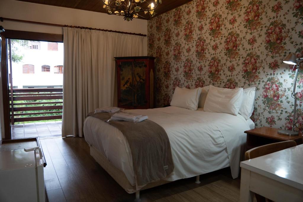 Postel nebo postele na pokoji v ubytování Hotel Ascona