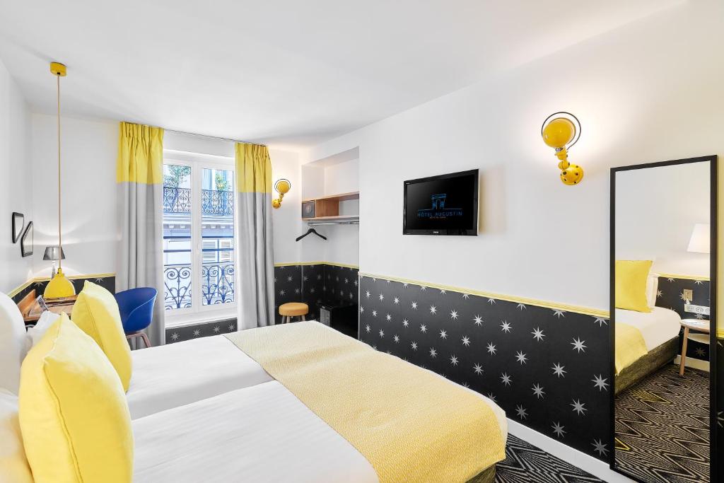 Postel nebo postele na pokoji v ubytování Hôtel Augustin - Astotel