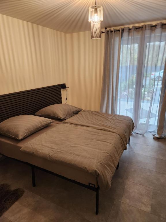 The Ferienwohnung tesisinde bir odada yatak veya yataklar