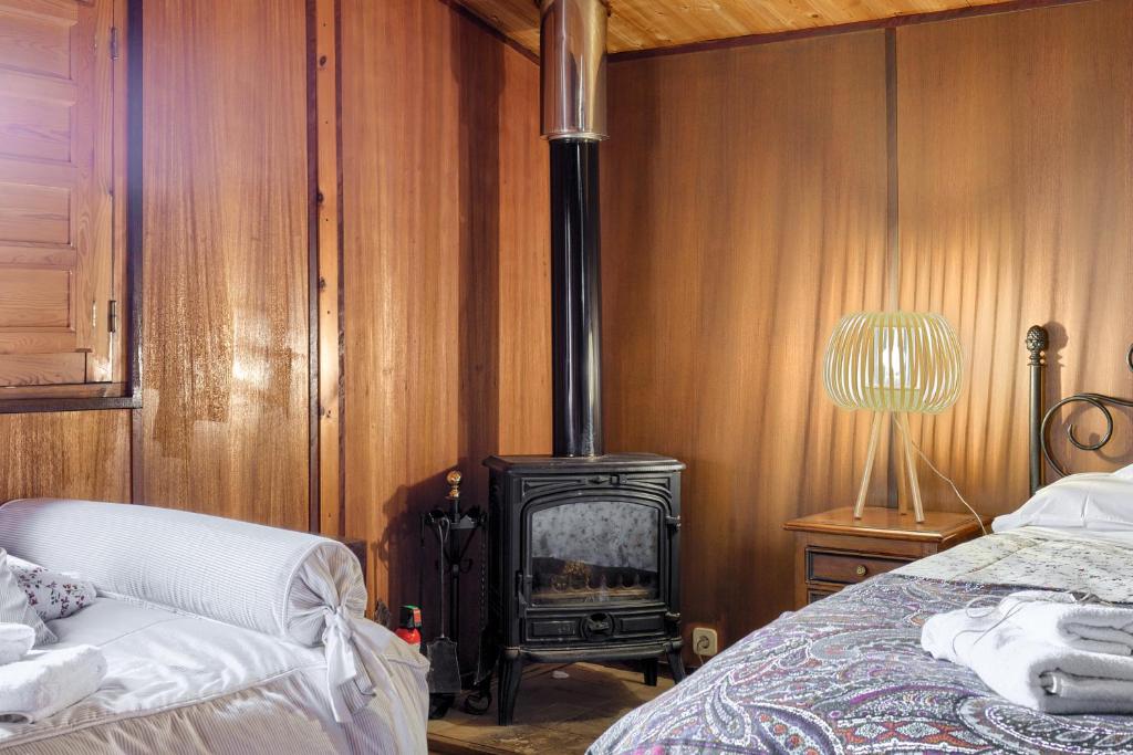 Postel nebo postele na pokoji v ubytování La Cabaña
