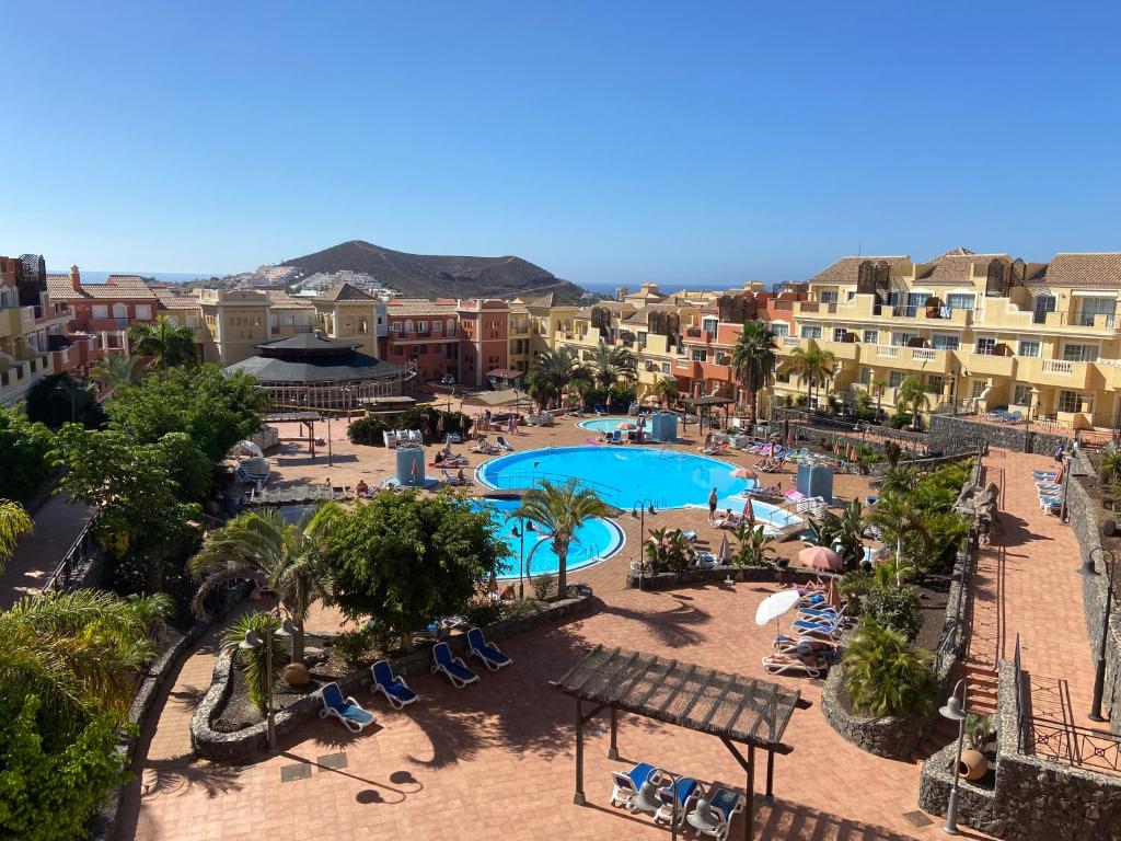 an aerial view of a resort with a swimming pool at Amazing Penthouse in Los Cristianos