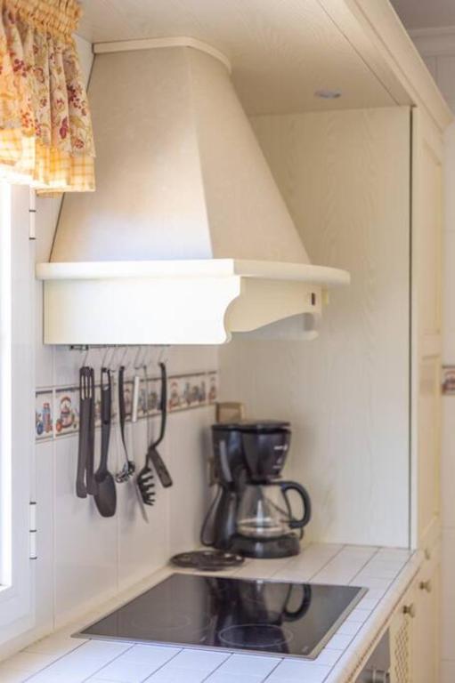 A kitchen or kitchenette at Holiday Villa Vergel with Huge Private Pool, Jacuzzi, Sauna & BBQ by Amazzzing Travel