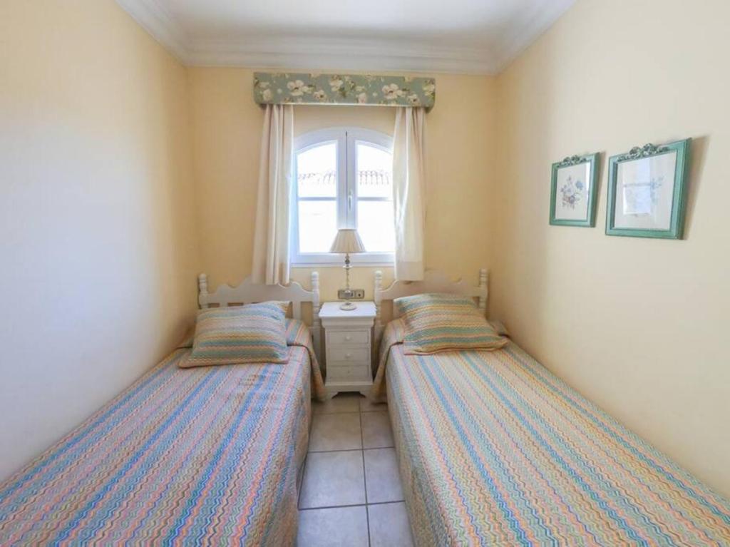 A bed or beds in a room at Holiday Villa Vergel with Huge Private Pool, Jacuzzi, Sauna & BBQ by Amazzzing Travel