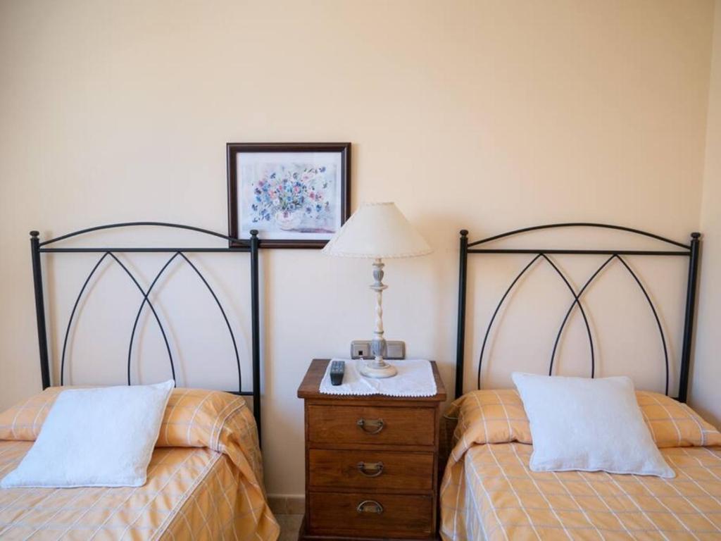A bed or beds in a room at Holiday Villa Vergel with Huge Private Pool, Jacuzzi, Sauna & BBQ by Amazzzing Travel